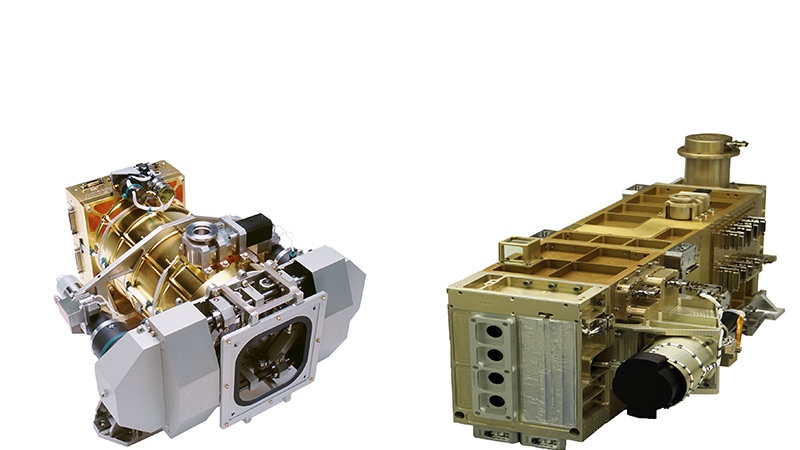 Two images of scientific instruments: on the left, a complex, multicolored assembly; on the right, a larger, modular metallic unit.