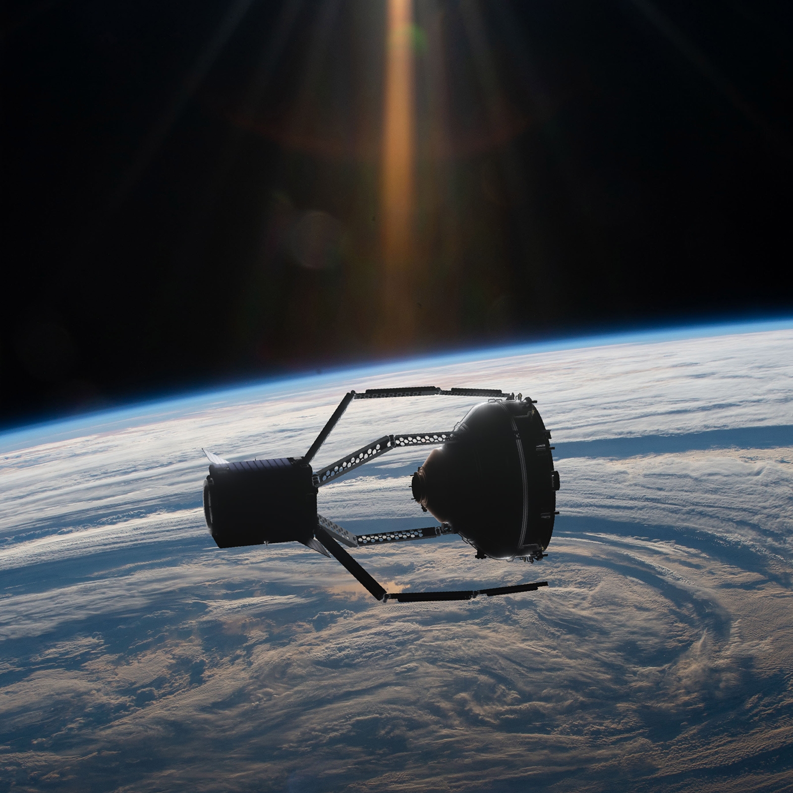 A spacecraft orbits above Earth with a view of the planet's curvature and atmospheric layers. Sunlight beams into the scene from the top.