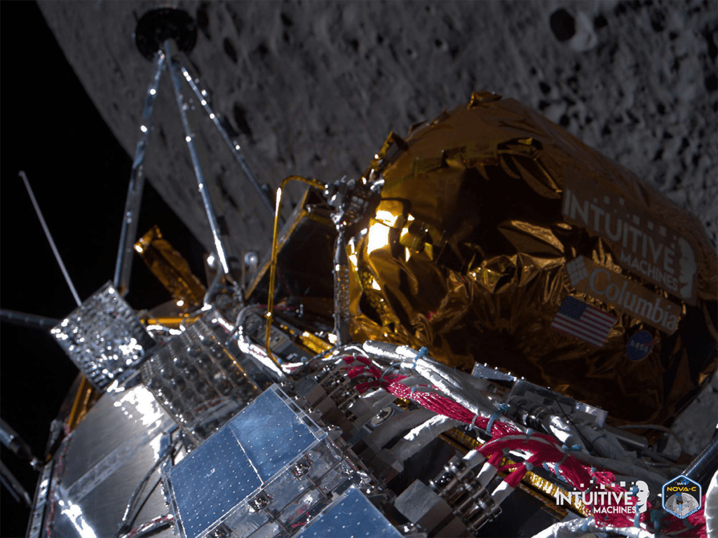 Spacecraft near the moon with reflective panels and gold foil, branded "Intuitive Machines" and "Nova-C," against the moon's surface background.