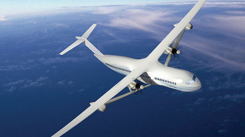 Aerial view of a white commercial airplane flying high above the clouds during the daytime.